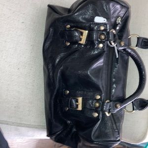 Cute, black, faux leather handbag, with cute gold colored buckle design on front